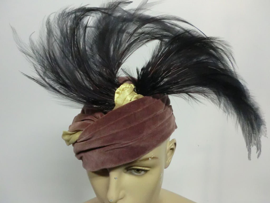 The house of Reboux was known for the very finest turbans, draped toques, and cloche hats. This hat is made of a fine and buttery soft velveteen, muted plum heather color, fully lined, and is a semi-structured hat, it is not stiff, it adapts to your