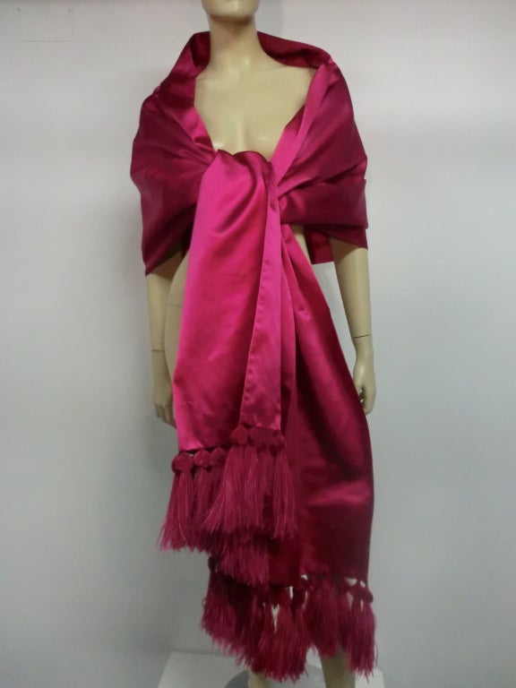 A French made magnificent unmarked Nina Ricci (purchased for wear with Nina Ricci caftan listed separately) fuchsia silk satin evening stole with luxurious hand-made ostrich feather tassels.  Over 117