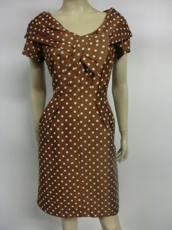 A super-cute 1950s silk shantung day dress from Tobie in cappuccino brown with white polkadots, a fitted bodice and shawl collar.