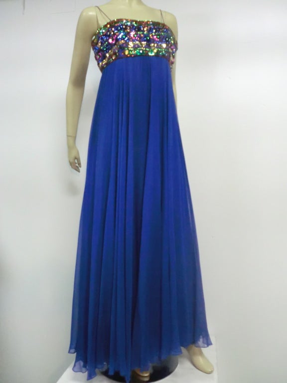 A fantastic cobalt blue silk chiffon bandeau style 60s evening gown from Malcolm Starr with heavily embellished bodice (mylar, sequins and beading),  and spaghetti straps.