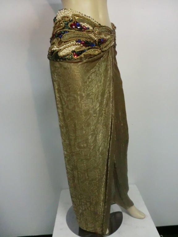 A gorgeous 80s Oscar de la Renta moiré lamé wrap skirt with cording, jewel-tone beads and faux pearl hip embellishments .  Size 6. Unlined.
