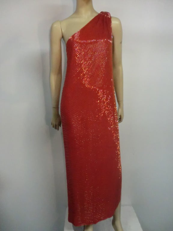A fabulous late 70s Anthony Muto bugle beaded silk column dress:  One shoulder construction with simple column shape, bottom side slit and shoulder closure.