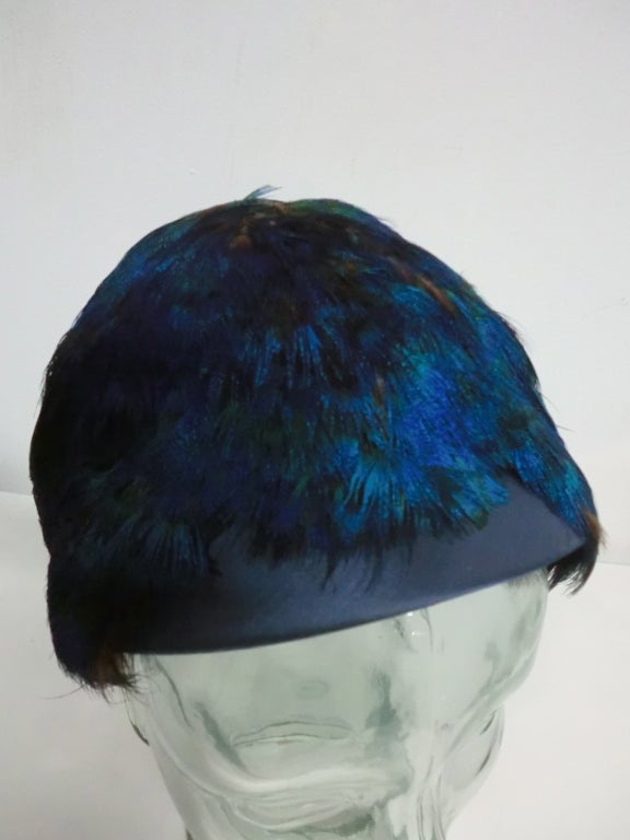 Fab 50s Juliette style hat in midnight blue silk satin with peacock (neck feathers) embellishment.