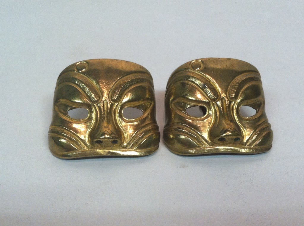 A fantastic pair of 80s Isabel Canovas gold tone metal Chinese Opera or Japanese Kabuki style mask earrings--clip on.  Quite large.