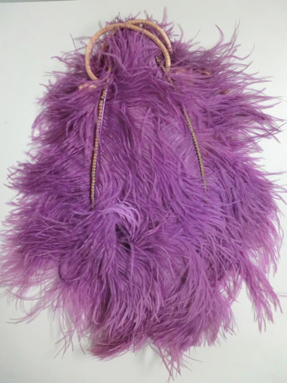 1920s extravagant fuchsia ostrich plume evening bag shaped like a folded up feather fan:  Beige satin handbag  with 2 handles buried under a 