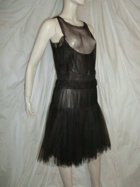 A gorgeous silk tulle Chanel dress in mint, never-worn, condition.  Tags still attached.  Recalls the 20's 