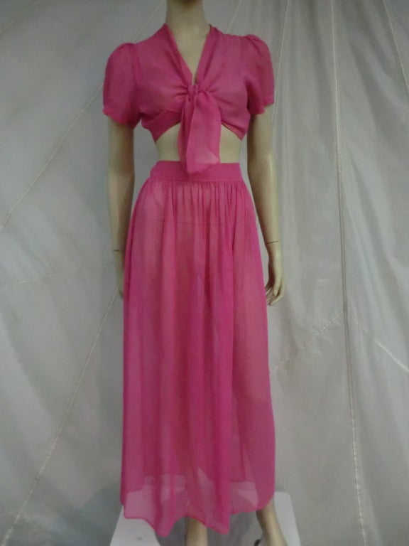 An adorable 1930's fuchsia pink voile lounging set with puff sleeves, a center tie closure on top and a wide high waistband and full long skirt.  Skirt button at the side.