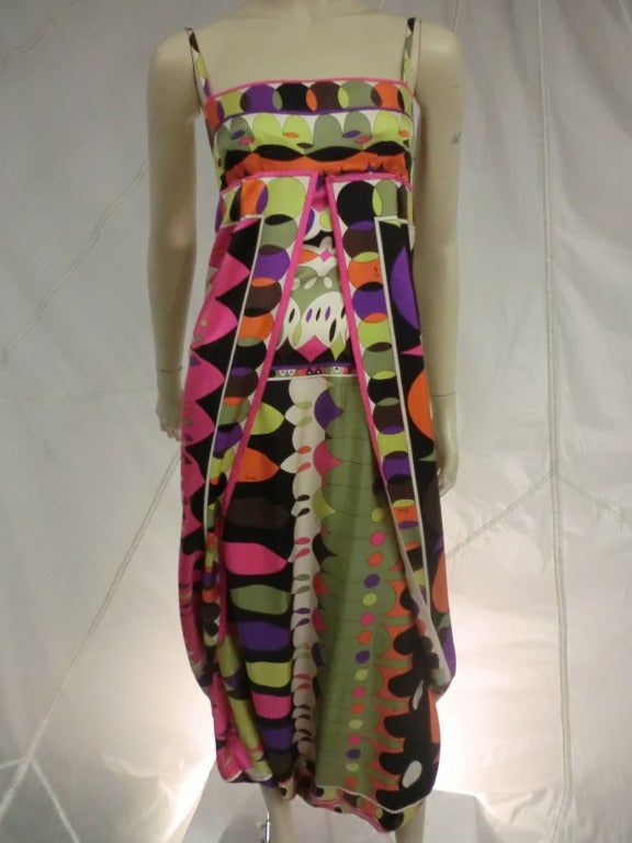 A fabulous and unusual 1960's Emilio Pucci wrap style jumpsuit in a beautiful print.  The bandeau top with spaghetti straps supports an unusual wrapped jumpsuit.  Fantastic!