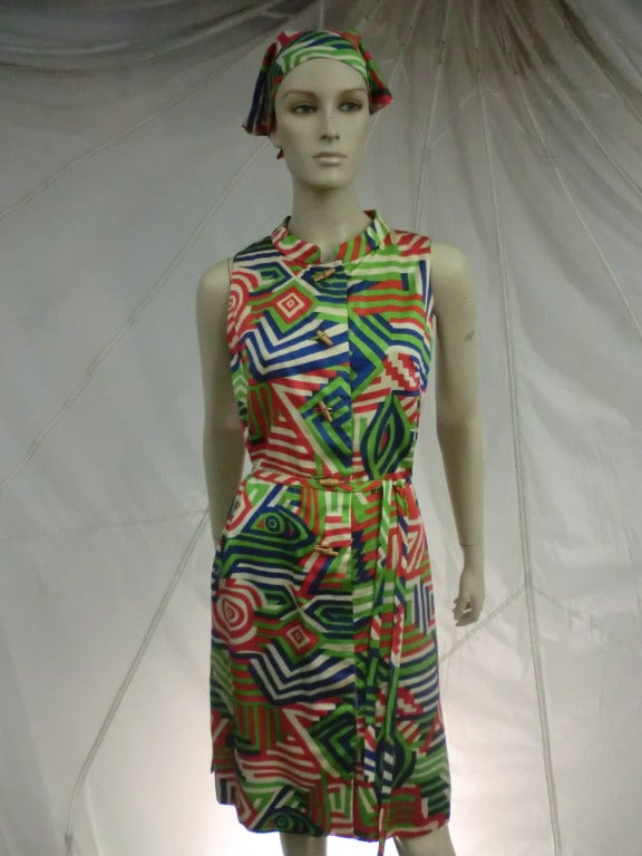 60's Geometric Colorful Tiki Print Cotton Shift Dress with Matching Tie Belt and Bandana Scarf Accessory.

Put the Tiki in your Kiki with this one!