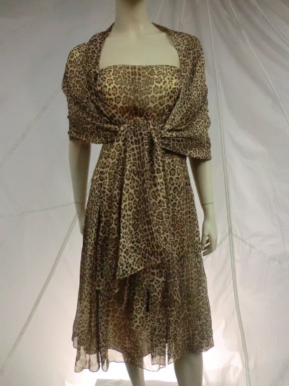A fabulous Halston leopard print silk chiffon strapless dress with fitted bodice and flared skirt: comes with matching long foulard.  Size 8.