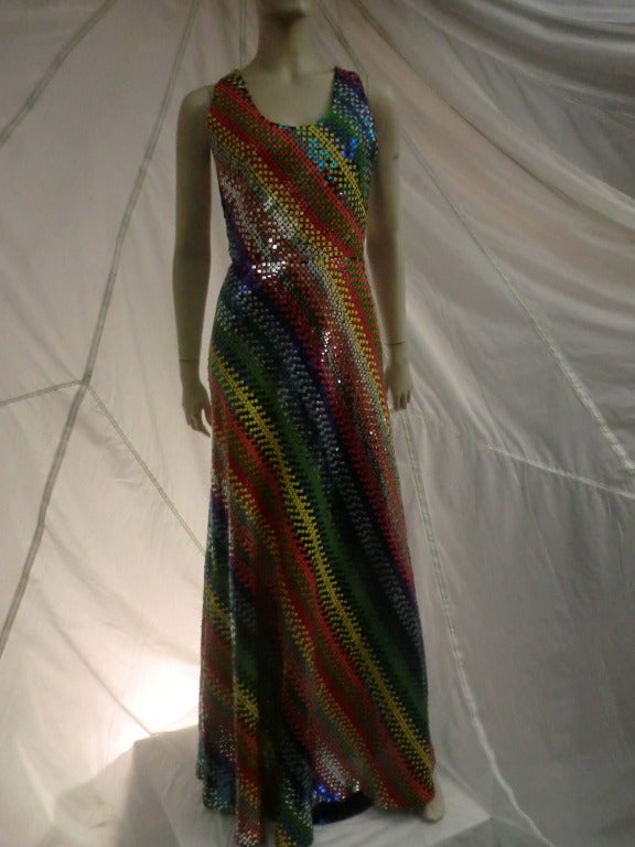 1970's André Laug sleek rainbow and metallic sequin disco style maxi dress with fitted waist and incredible sequin pattern.  Fully lined.