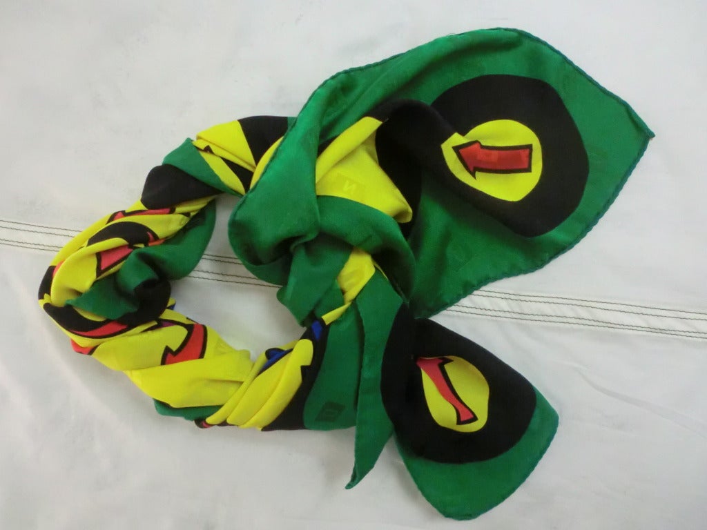 A bold 1980's Moschino hand-rolled silk Jacquard scarf in a green, yellow and black 