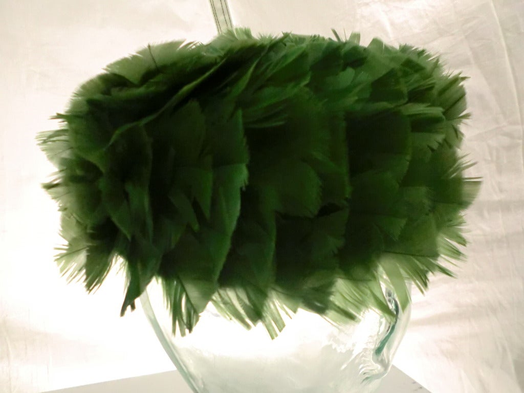 A beautiful kelly green turkey feather covered pill box hat from Terry B.  Stiffened tulle base with gorgeous feather work.