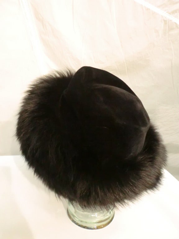 A gorgeous 1960s Emme hat in a flowerpot shape. The crown is velvet and the brim is covered in black fox.  Very 