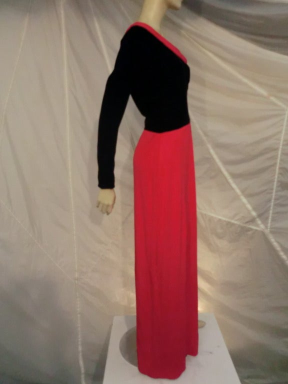 A beautiful and dramatic Carolina Herrera evening gown in black silk velvet and red silk jersey:  Fitted bodice and draped skirt.  Side zip.