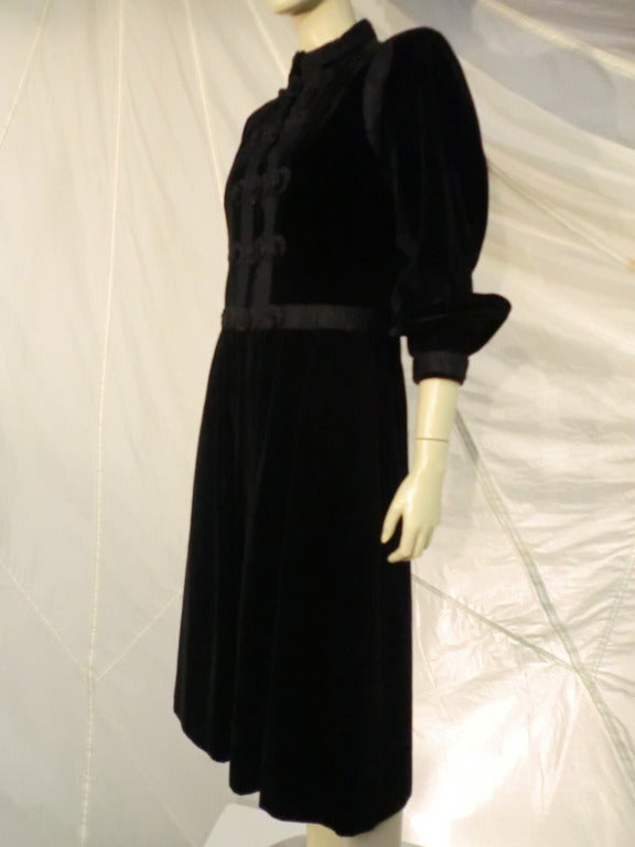 A fantastic Yves Saint Laurent velvet coat and skirt with heavy braid trim and band collar. Marked a French size 42

From YSL's iconic Russian Collection!!!