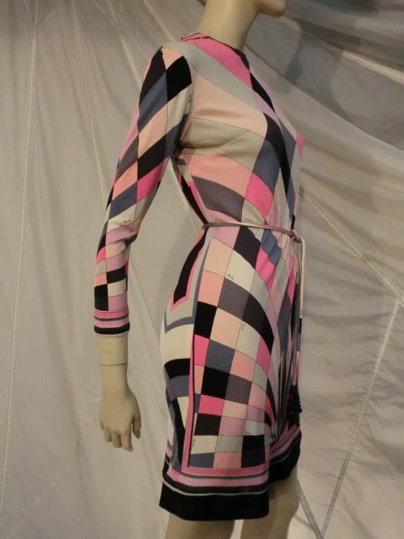 A wonderful 1960s Emilio Pucci silk jersey mini dress: Long sleeves with zipper in back, banded cuffs and hem and original matching belt with bead tassels at ends.