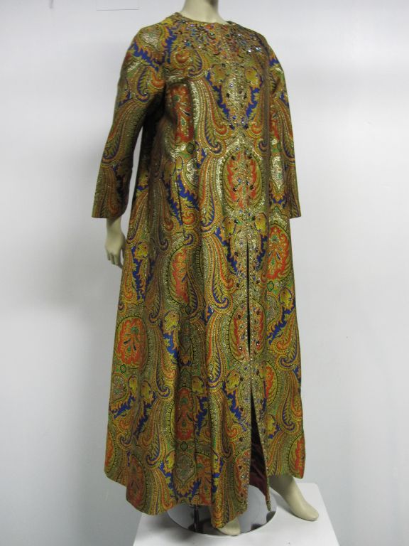 A wonderful Nina Ricci Couture piece from the early 70s; a paisley pattern, rhinestone embellished full length evening coat.