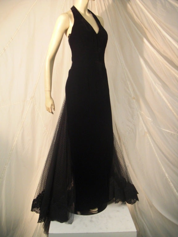 A stunning early 1990s Lorcan Mullany designed ball gown for couture house Bellville Sassoon:  Velvet full-length halter-neck gown with velvet bow, lace and tulle fishtail inserts in back train.