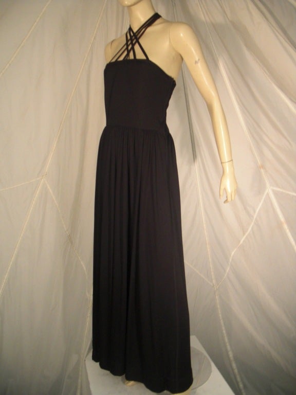 A beautiful Donald Brooks 1970s black jersey dress with multiple criss crossed spaghetti straps that form a bodice design.  Gently gathered skirt at waist.