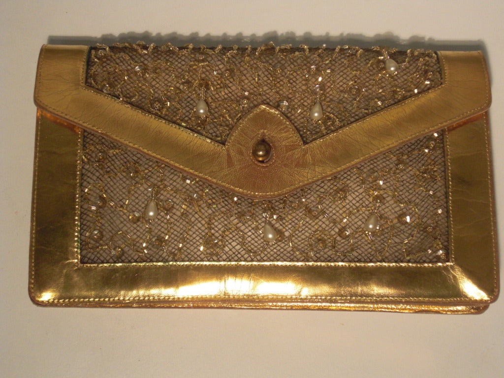 A marvelous 1950s Koret evening bag that is absolutely modern in design--and big enough for a cell phone!  A true envelope clutch with framework and structure of gilt leather, with sheer beaded, sequined and punctuated with pearl teardrop inset