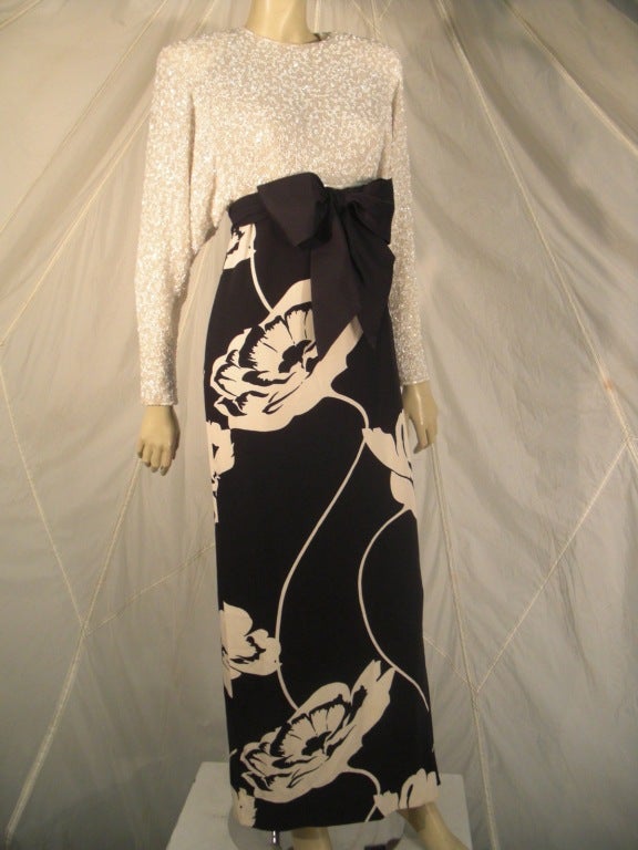 A beautiful 1987 James Galanos evening gown in black and white floral print crepe skirt and heavily beaded chiffon bodice and sleeves.  Fully lined.  Custom made.