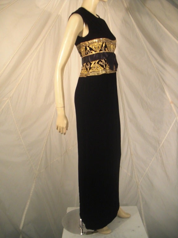 A gorgeous 1960s I. Magnin velvet column Empire waist gown with elaborate gold cording, sequin, rhinestone and bead embellished bodice and satin bow. Fully lined and gorgeous.