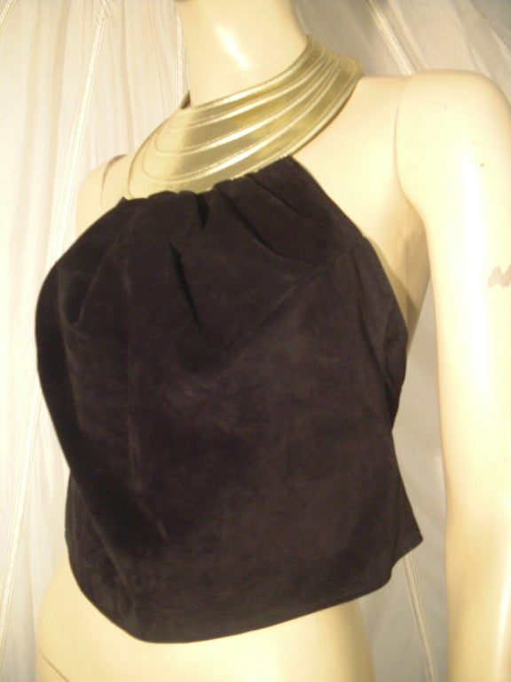 A silk lined black suede 1970s Charles Jourdan halter top with fantastic silver metallic leather molded collar piece, which snaps closed in the back.  Suede part also closes with 3 covered snaps.