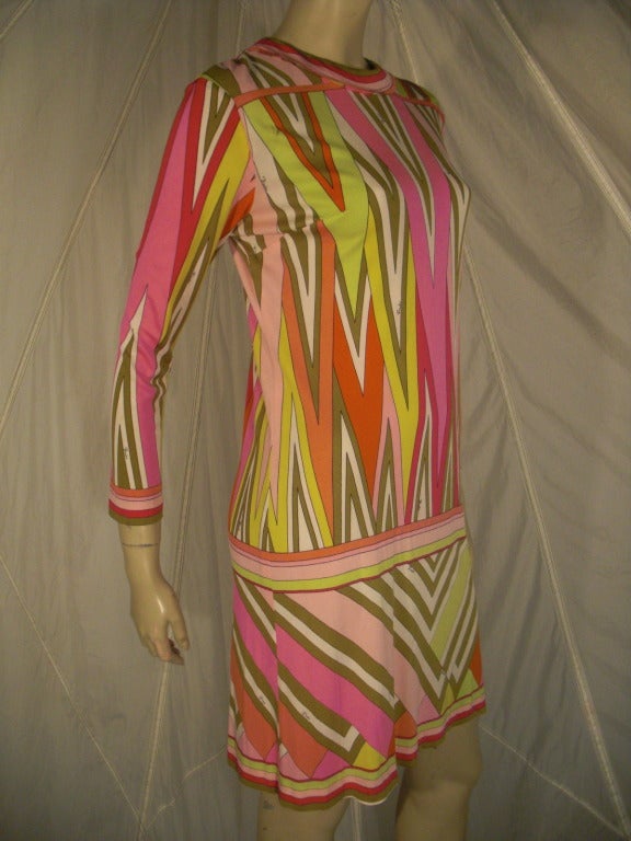 A fantastic 1960s Emilio Pucci silk jersey mini dress in a fantastic geometric pattern. Color palette includes white, pink, fuchsia, olive and chartreuse.