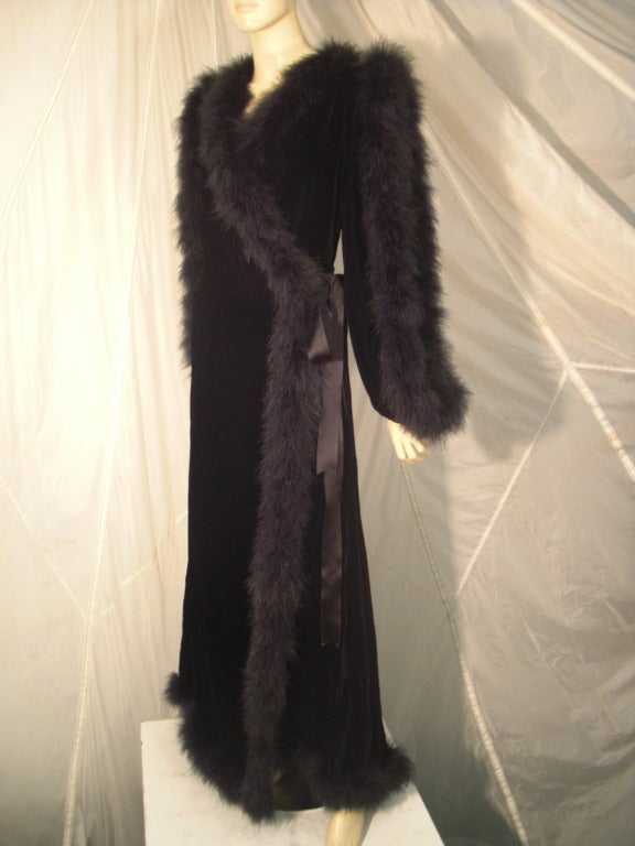 A fantastic 1970s Fernando Sanchez velvet dressing gown edged in marabou: Arms are open and marabou edged for a sexy silhouette. Wrap closure with a satin ribbon tie.