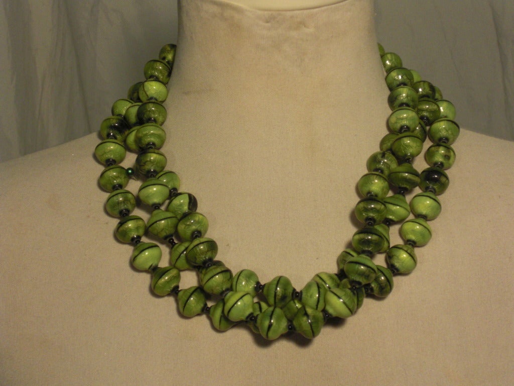 A gorgeous 1950s three-strand hand-made opaque glass bead necklace.