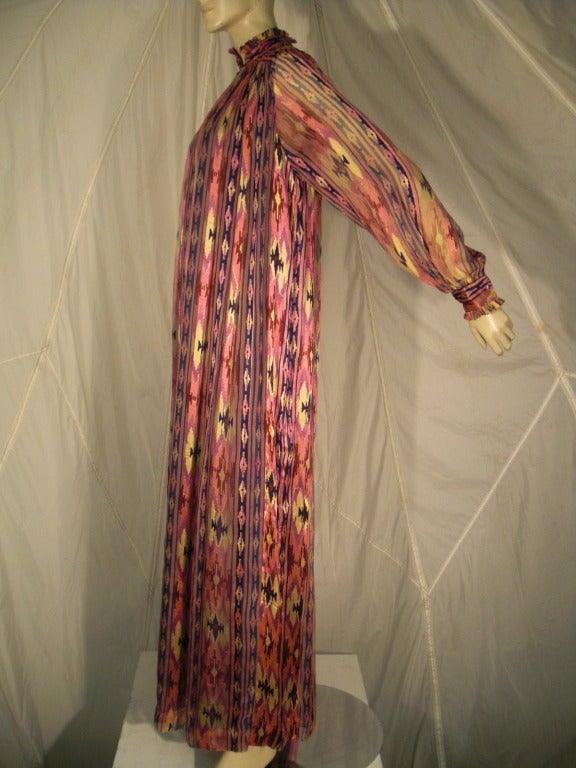 1970s Raksha ikat print silk chiffon caftan with high ruffled neck and cuffs.  Lined, double layer construction.  come with optional matching belt. Originally sold at Neiman Marcus.