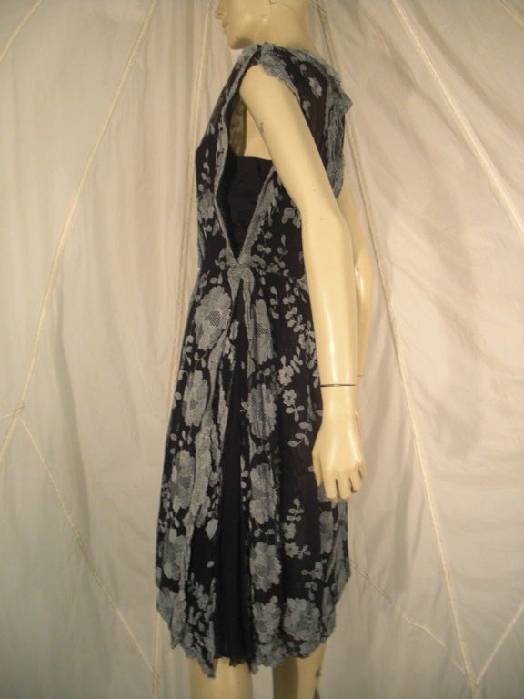 1960s James Galanos embroidered tulle tabard style dress in layered panels.  Gorgeous dove gray embroidery on black tulle.