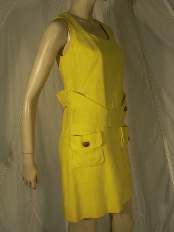 A wonderful 1960s Mod style yellow linen mini dress:  Featuring patch front hip pockets and wide contour belt.