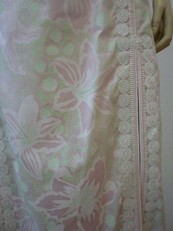 This is a wonderful summer dress from Lilly Pulitzer!  It's an empire waist style sleeveless full length dress with high slits trimmed in braid work.  Printed over the whole with large lilies in pink, white and green.<br />
<br />
Size is marked a
