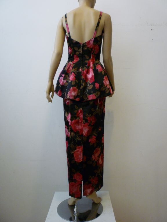 A fantastic example of Mr. Blackwell's (unmarked but confirmed)1950s style with a fitted column silhouette and beautiful structured peplum!  The fabric is extremely fine silk satin with velvet shot through the rose print.  Divine!