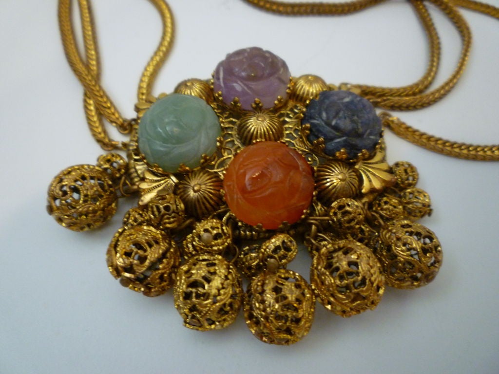 Wonderful Leo Glass late 30s medallion choker: triple chain strand with large filigree medallion with colored carved glass stones and filigree balls drops!  Neck chain measures 16