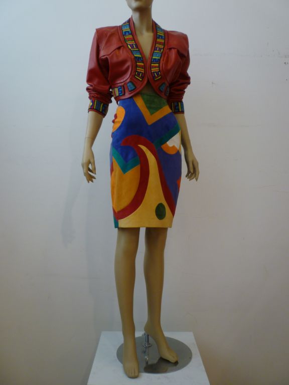 Jean-Claude Jitrois suede skirt elaborately inset in multicolor pop-art style. Skirt marked a French size 38.  Red leather bolero jacket with beaded trim. Approx. US size 4-6. <br />
<br />
Jean-Claude Jitrois made leather pieces of the finest