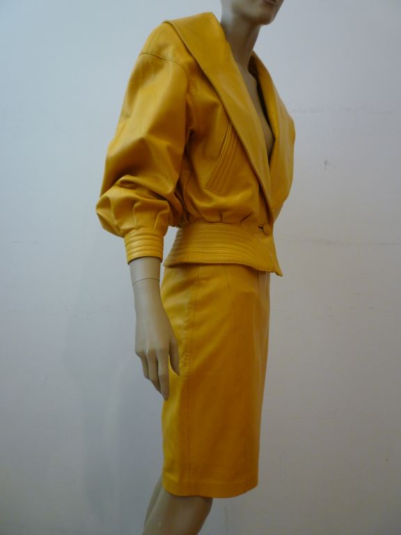 Jean Claude Jitrois rich yellow leather skirt suit w/ shawl collar and trapunto stitching at the waist, pockets and jacket cuffs.<br />
<br />
<br />
Jean Claude Jitrois made leather pieces of the finest quality in the 80s in Paris with expressly
