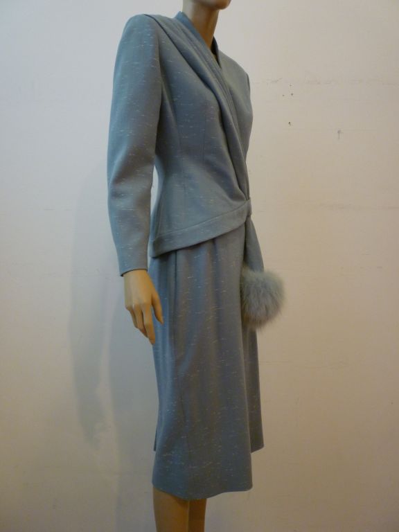 Fantastic Lilli Ann suit from 1958 with asymmetrical styling and fox trim!  A wonderful lightweight wool in pastel blue with white slubs throughout.  <br />
<br />
From Harper's Bazaar ad: 