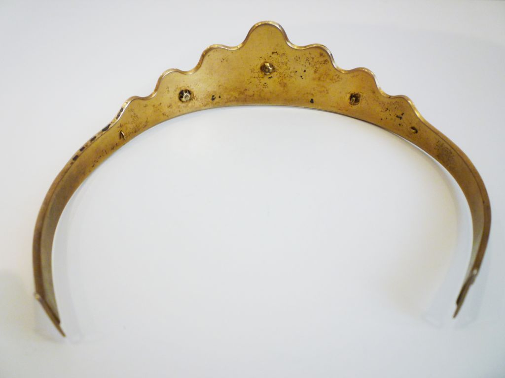 A gorgeous turn-of-the-century tiara in with scrolled leaf details and a carved cameo in Persian turquoise. Ends are made for a ribbon attachment.  A gorgeous collectors piece with a beautiful patina!