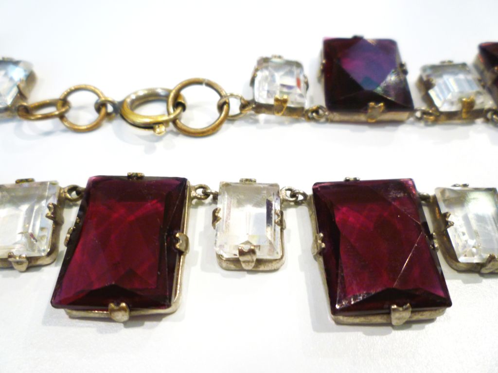 A beautiful Czech glass Art Deco 20s necklace in burgundy and clear open-back set pieces.  Large burgundy pieces are 3/4