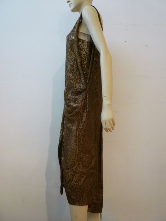 A beautiful 1920s silk lamé cocktail chemise in silvery metallic and a greenish-brown background.  Drop-waisted and ruched in the front with a longer pleated back panel. Gorgeous!
