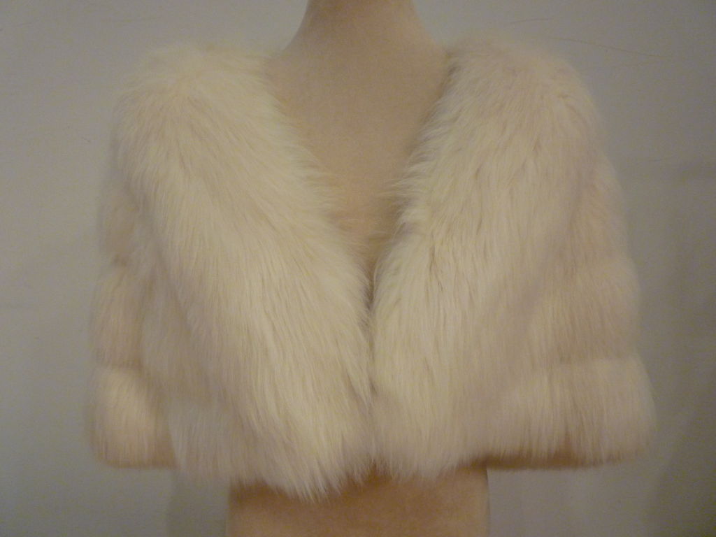 A magnificent 1950s I. Magnin white fox fur stole with 4 tiers of pelts for lots of coverage.  Luxurious, glamorous warmth for the holidays!  One hook and eye at bottom center.<br />
<br />
23