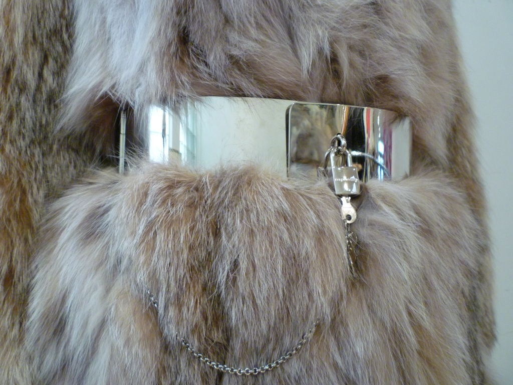 A gorgeous 1970s calf-length lynx coat!  No label, but beautiful!  Satin lined with monogram.  Straight cut and fit with structured shoulder.  <br />
<br />
Dolce and Gabanna chrome lock belt sold separately. Please inquire.