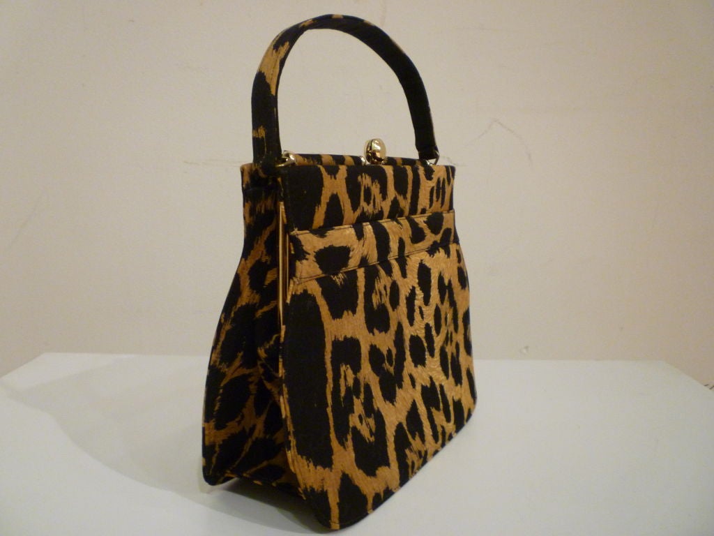 An adorable 50s silk leopard print handbag made expressly for Paul Allan. Faille interior. In Excellent condition inside and out!  <br />
<br />
Measures: <br />
<br />
11