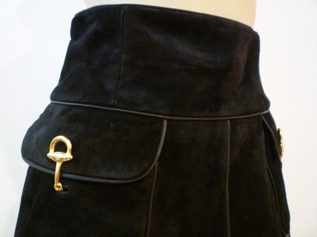 Gucci genuine 70s black suede skirt, A-line with leather piping and metal toggle closure pockets.