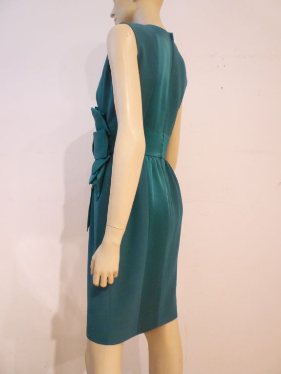 A darling Moschino Couture! sleeveless dress with alternating satin/crepe awning stripes and large bow at waistline!  So chic!