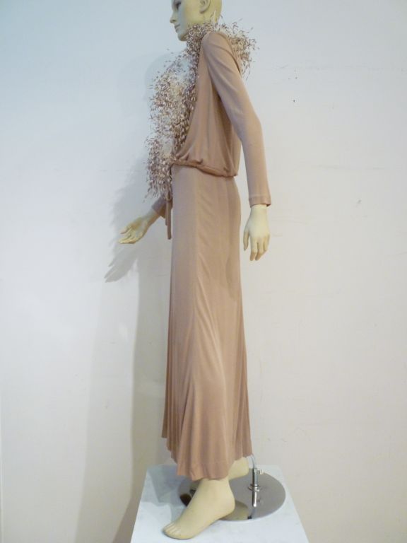 Mollie Parnis Boutique 2-piece silk jersey ensemble in praline/clay tones.  The halter dress is slinky and sexy with a waist band inset.  The waist-tie jacket has a collar of fabulous natural ostrich feathers! Marked a vintage size 12.  Approx. a