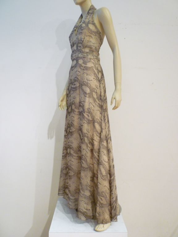 Futura Couture 1970s snake print chiffon halter gown with beige lining. Marked a vintage size 10.  Modern size 4 approx.